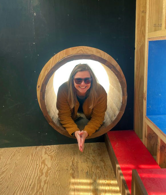Peeking inside the barrel-wood-framed portal entrance
